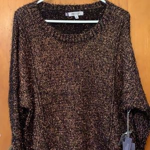 Jennifer Lopez black copper sweater